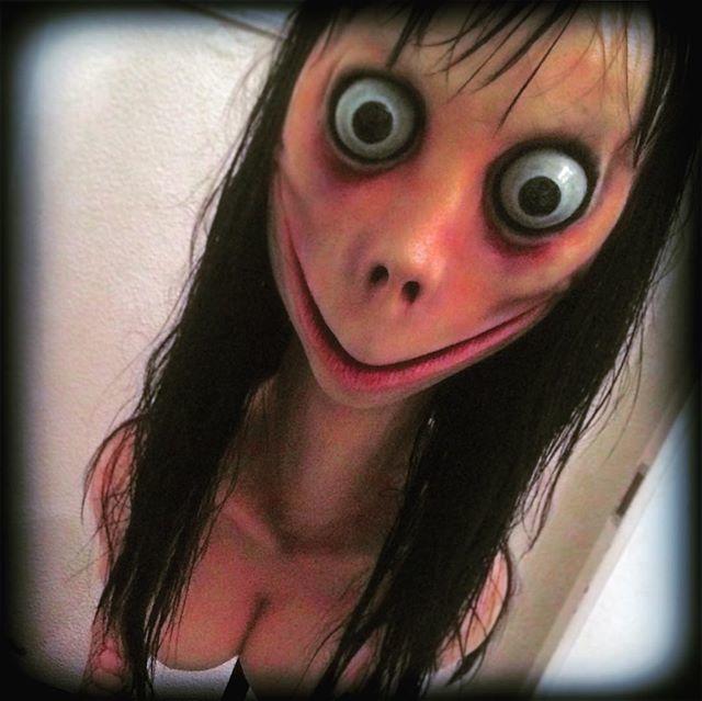 Momo meme - Momo is a nickname given to a sculpture of a young woman with long black hair, large bulging eyes, a
